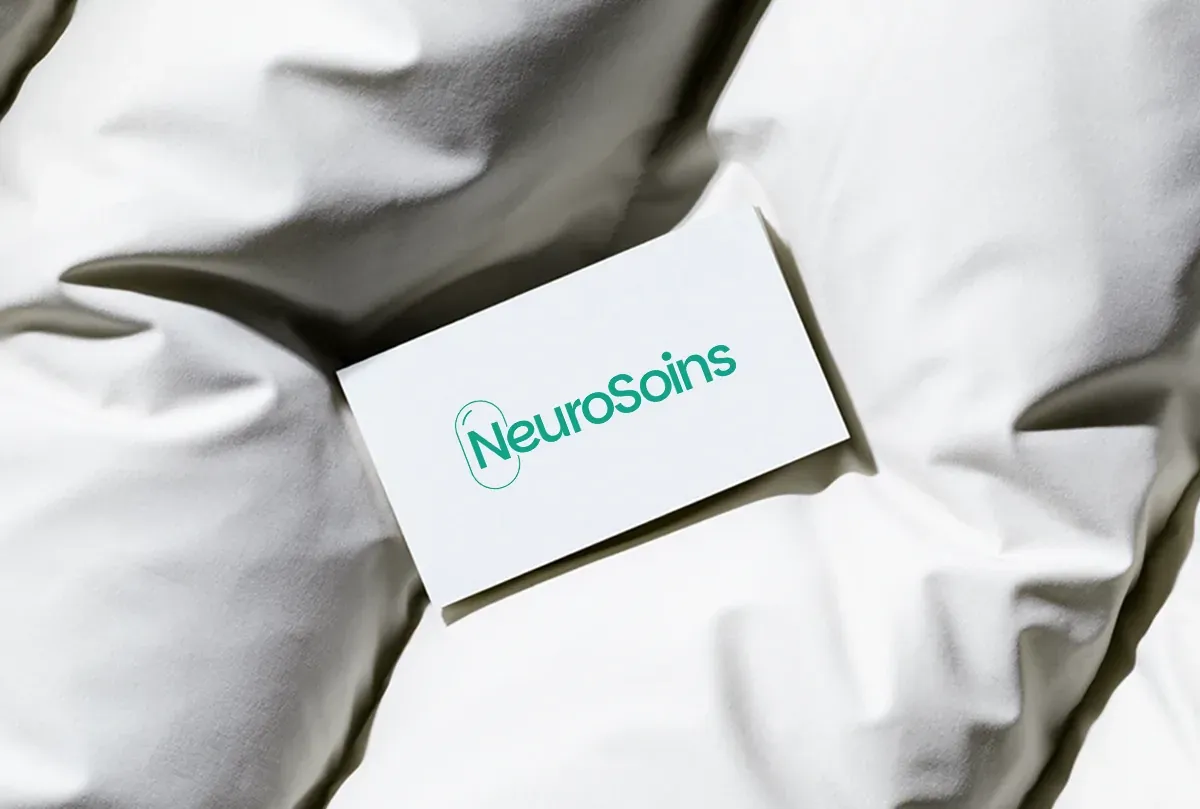 NeuroSoins business card with the teal wordmark